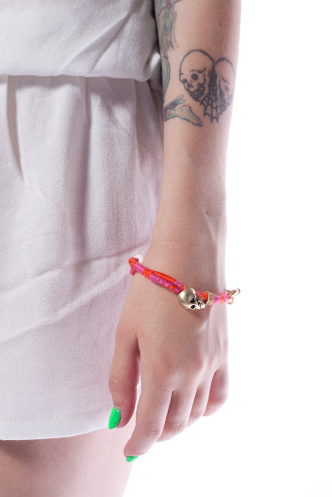 Disney Couture Pirates of the Caribbean Braided Skull Bracelet - Pink